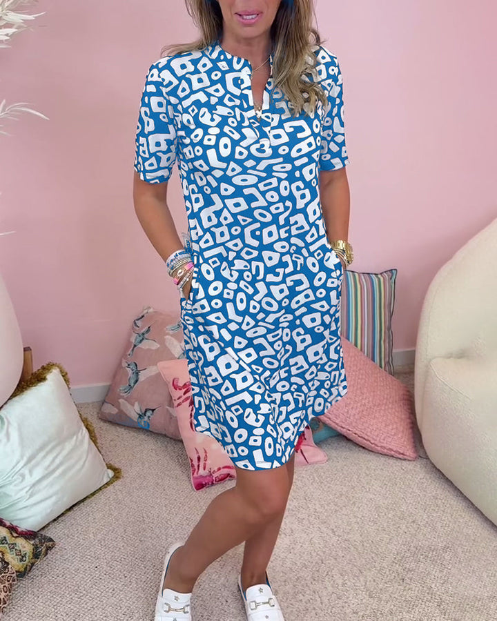 Viaro   | Printed dress with V-neck and pockets